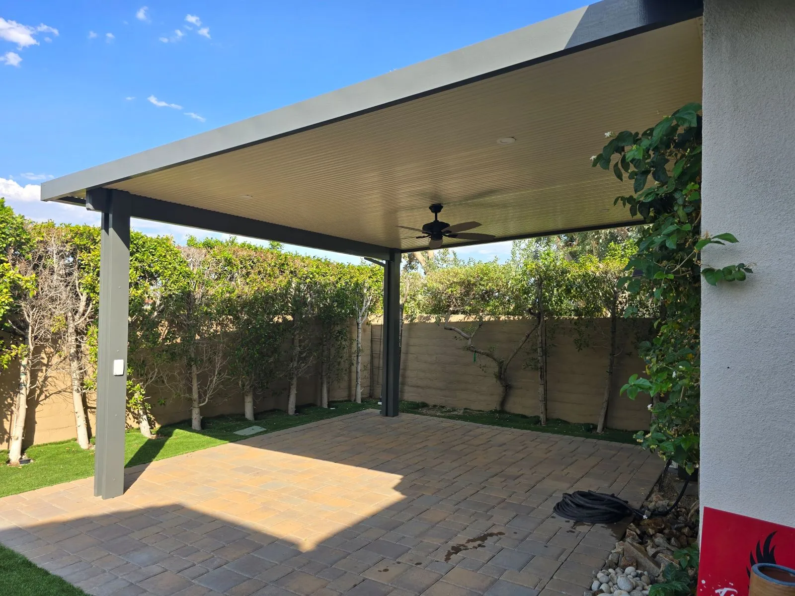 Duralum attached flat pan patio cover in Sandalwood and Slate on a DFW home