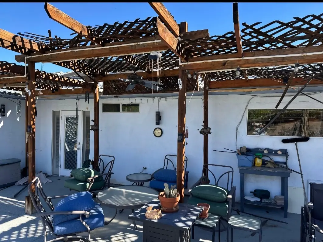 An old wood pergola that's falling apart